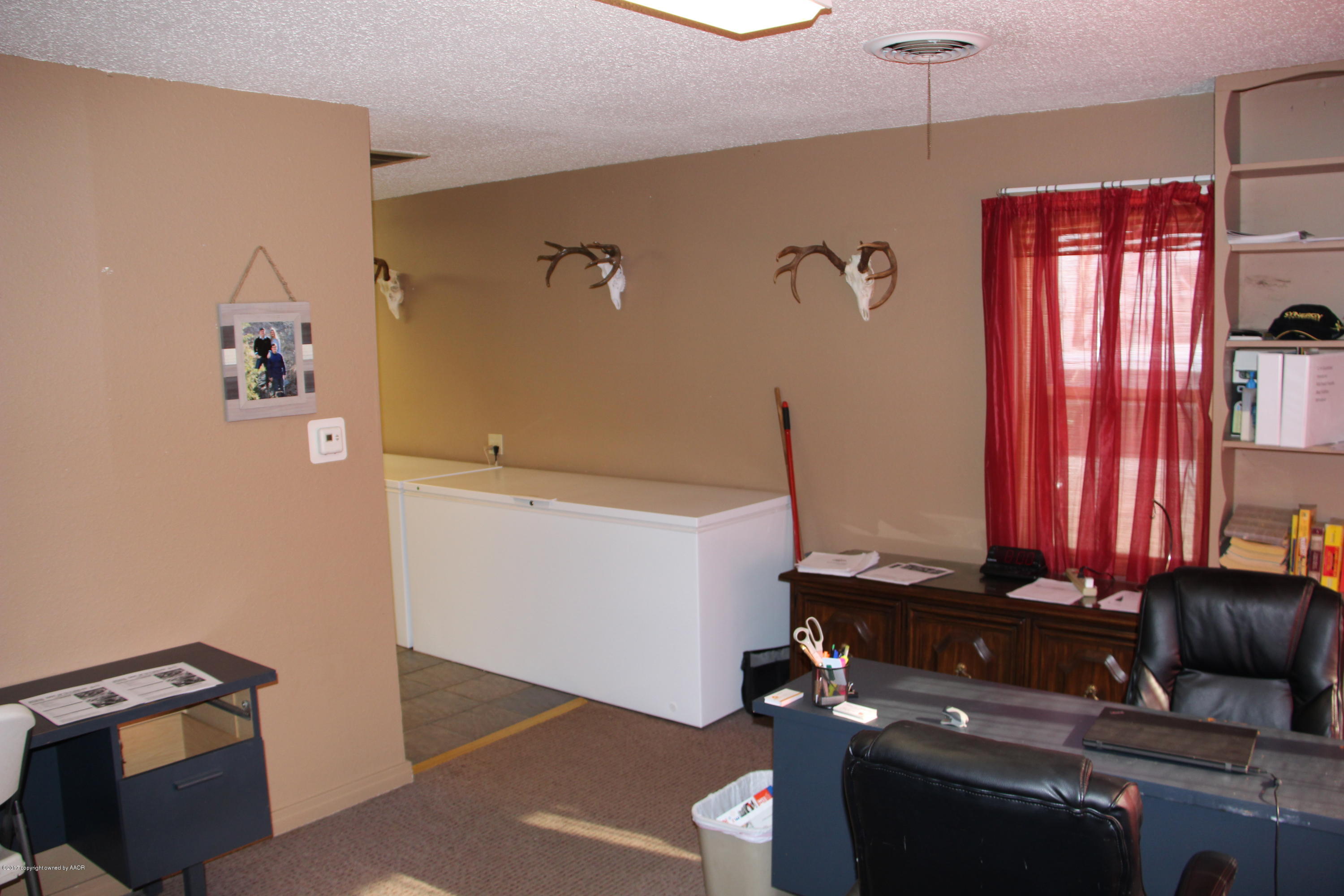 4118 South Washington Street Amarillo, TX 79110 - Photo 3 of 18 a room with furniture and cabinets