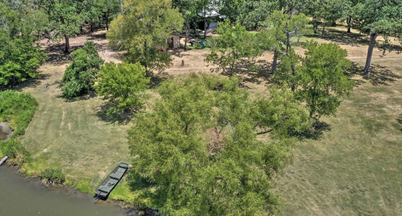 10630 River Ranch Road Kemp, TX 75143 - Photo 3 of 36 a view of a yard with plants and large trees