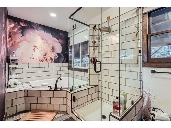 a bathroom with a bathtub and shower