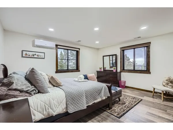 a bedroom with a large bed and a window