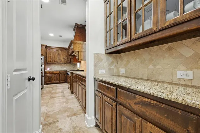 a kitchen with stainless steel appliances granite countertop a stove and a sink