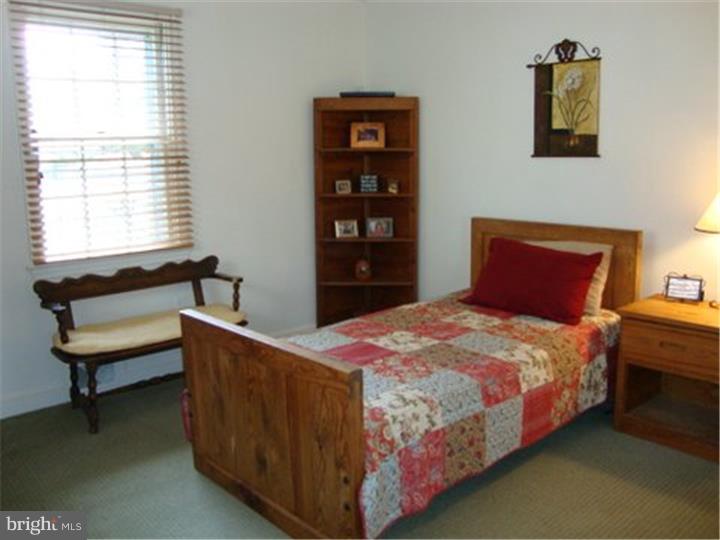 1314 Youngs Ford Road Gladwyne, PA 19035 - Photo 13 of 22 a bedroom with a bed and a window