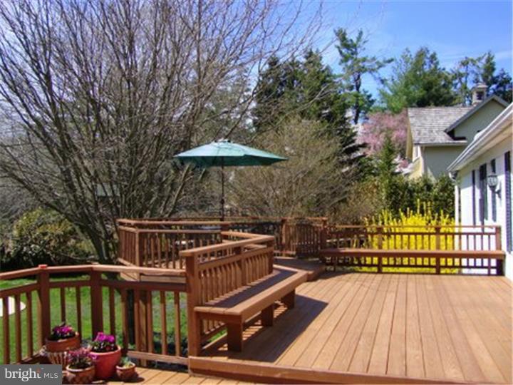 1314 Youngs Ford Road Gladwyne, PA 19035 - Photo 18 of 22 a view of a roof deck with chair and wooden floor