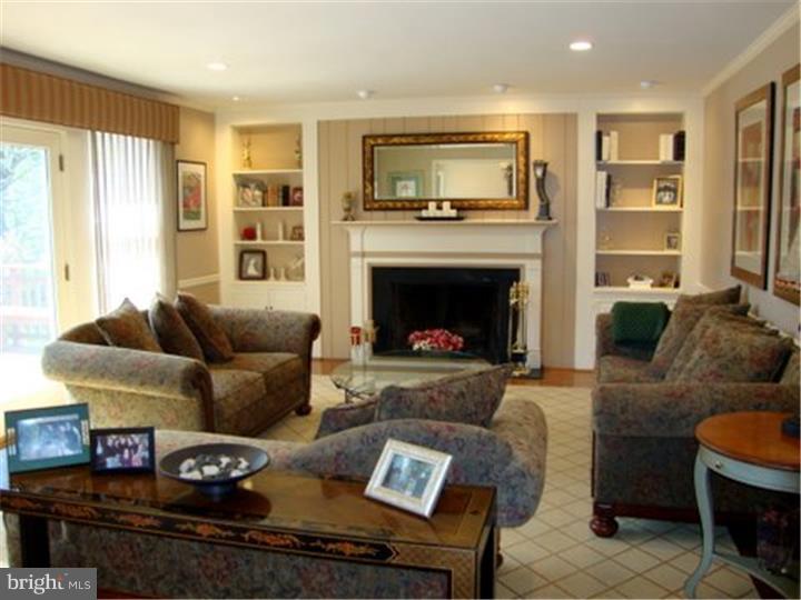 1314 Youngs Ford Road Gladwyne, PA 19035 - Photo 5 of 22 a living room with furniture and a fireplace