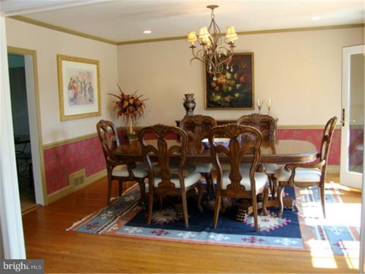 1314 Youngs Ford Road Gladwyne, PA 19035 - Photo 6 of 22 a view of a dining room with furniture and wooden floor