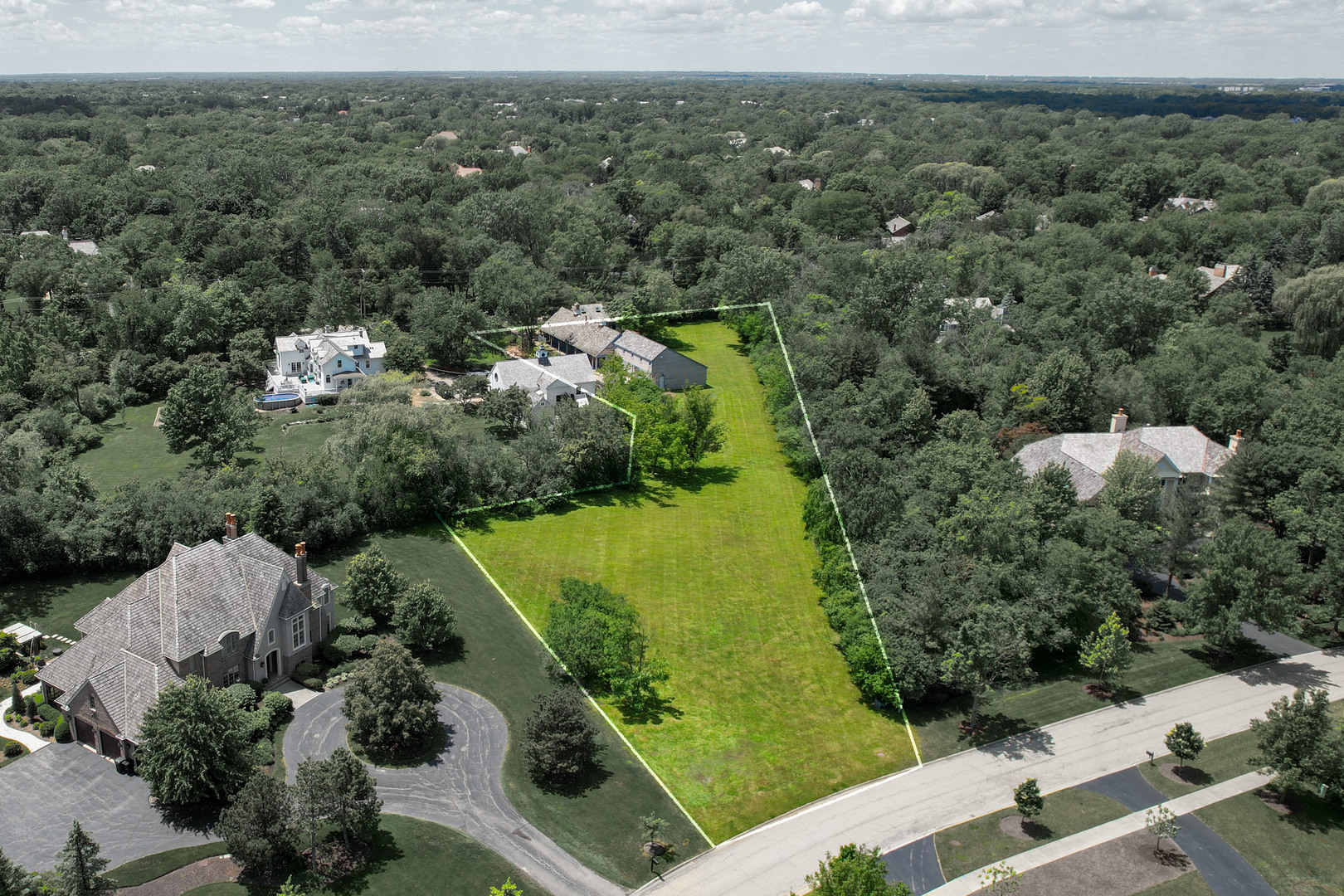855 South Ridge Road Lake Forest, IL 60045 - Photo 18 of 22 an aerial view of green landscape with trees houses and mountain view