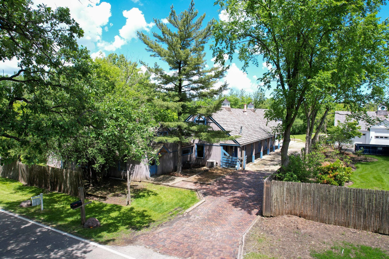 855 South Ridge Road Lake Forest, IL 60045 - Photo 2 of 22 a front view of a house with a garden