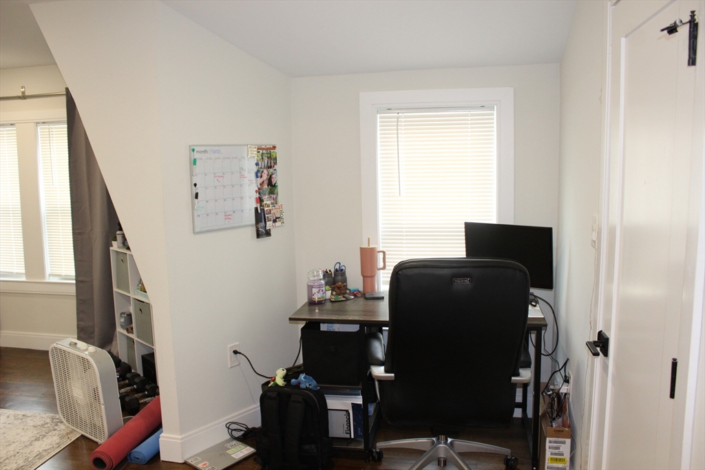 15 Pomeroy Street, Unit 15 Boston, MA 02134 - Photo 7 of 7 a bedroom with a bed and a window