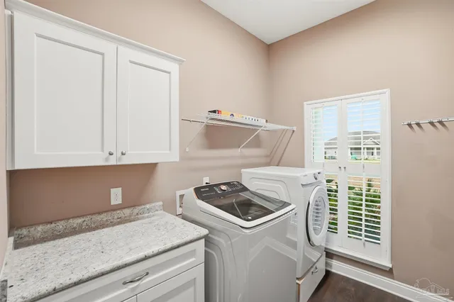 a kitchen with granite countertop a sink and a stove next to a window