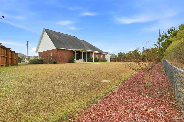 a view of swimming pool with a yard