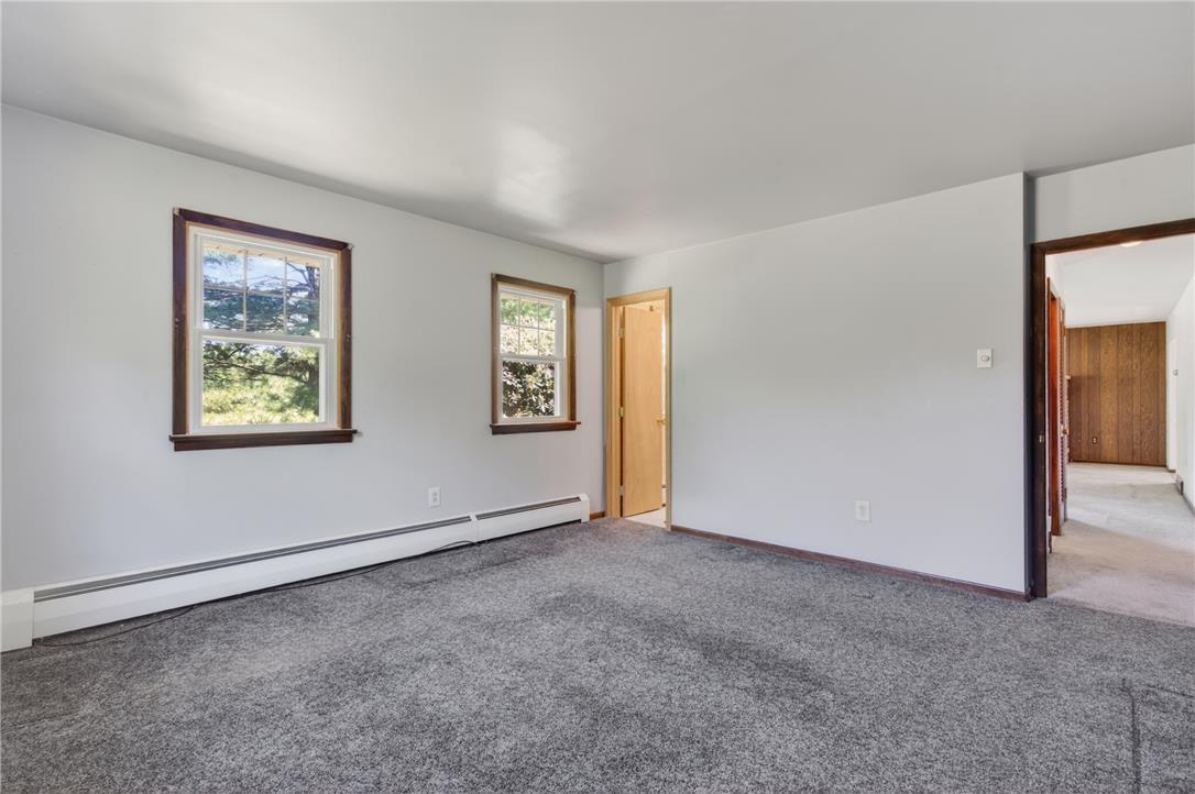 62 Stoney Road Tamaqua, PA 18252 - Photo 40 of 61 A well-lit interior space features new carpeting, offering a clean and inviting atmosphere.