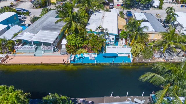 an aerial view of a house with a lake view