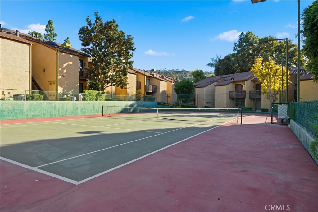 4140 Workman Mill Road, Unit 137 Whittier, CA 90601 - Photo 18 of 20 a view of a house with a swimming pool