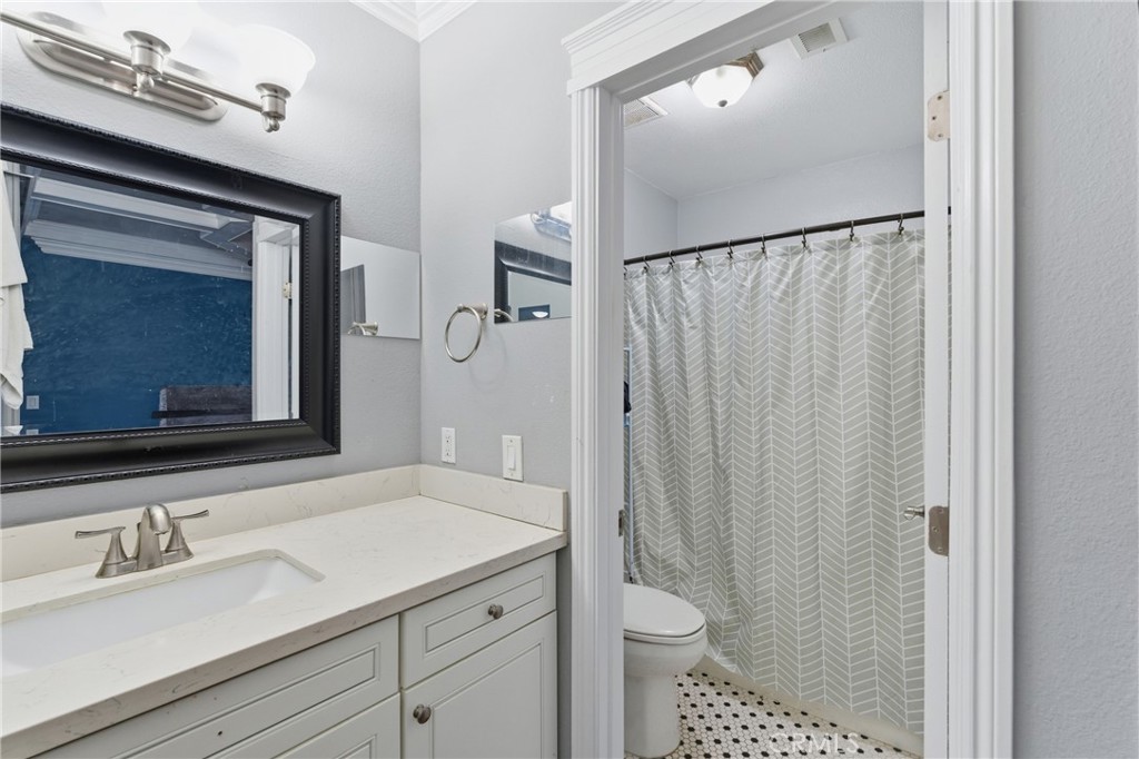 4140 Workman Mill Road, Unit 137 Whittier, CA 90601 - Photo 4 of 20 a bathroom with a sink a toilet and shower