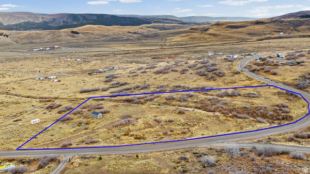 349 West Mountain View Road, Unit 349 Fairview, UT 84629 - Photo 2 of 26 Expansive undeveloped land parcel featuring a storage shed and direct road frontage