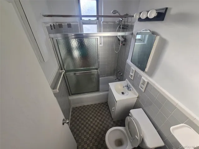 a bathroom with a toilet and a sink