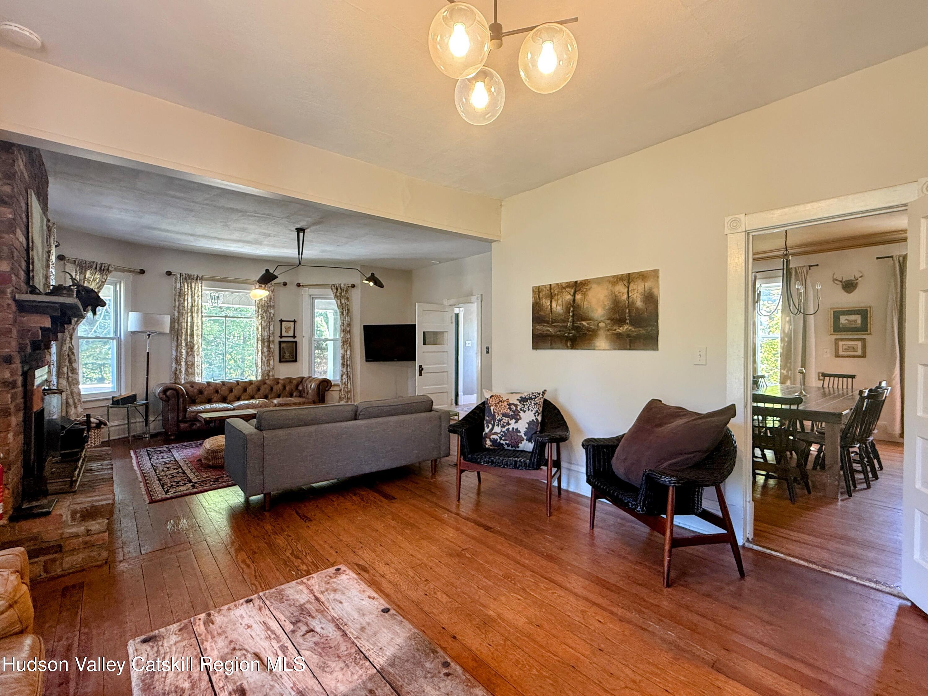 42-50 Stoney Clove Road Hunter, NY 12442 - Photo 13 of 82 a living room with furniture and a wooden floor