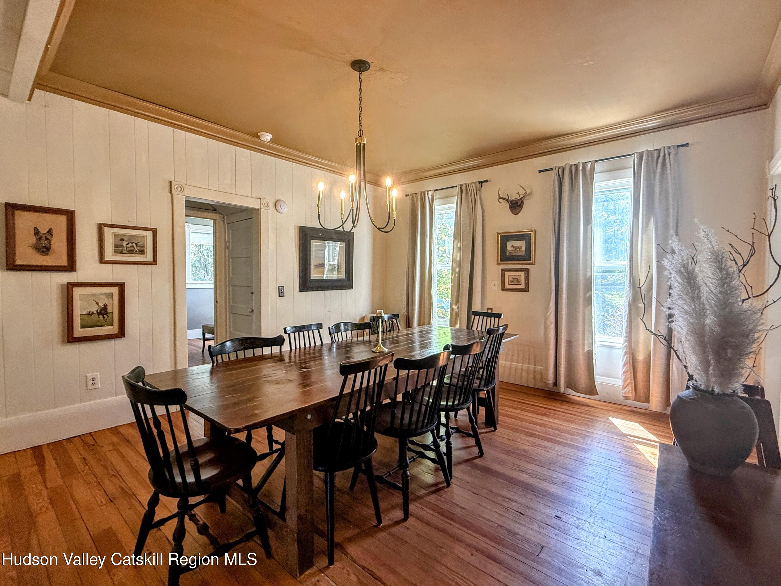 42-50 Stoney Clove Road Hunter, NY 12442 - Photo 15 of 82 a view of a dining room with furniture window and wooden floor