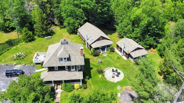 a view of a yard with a tree