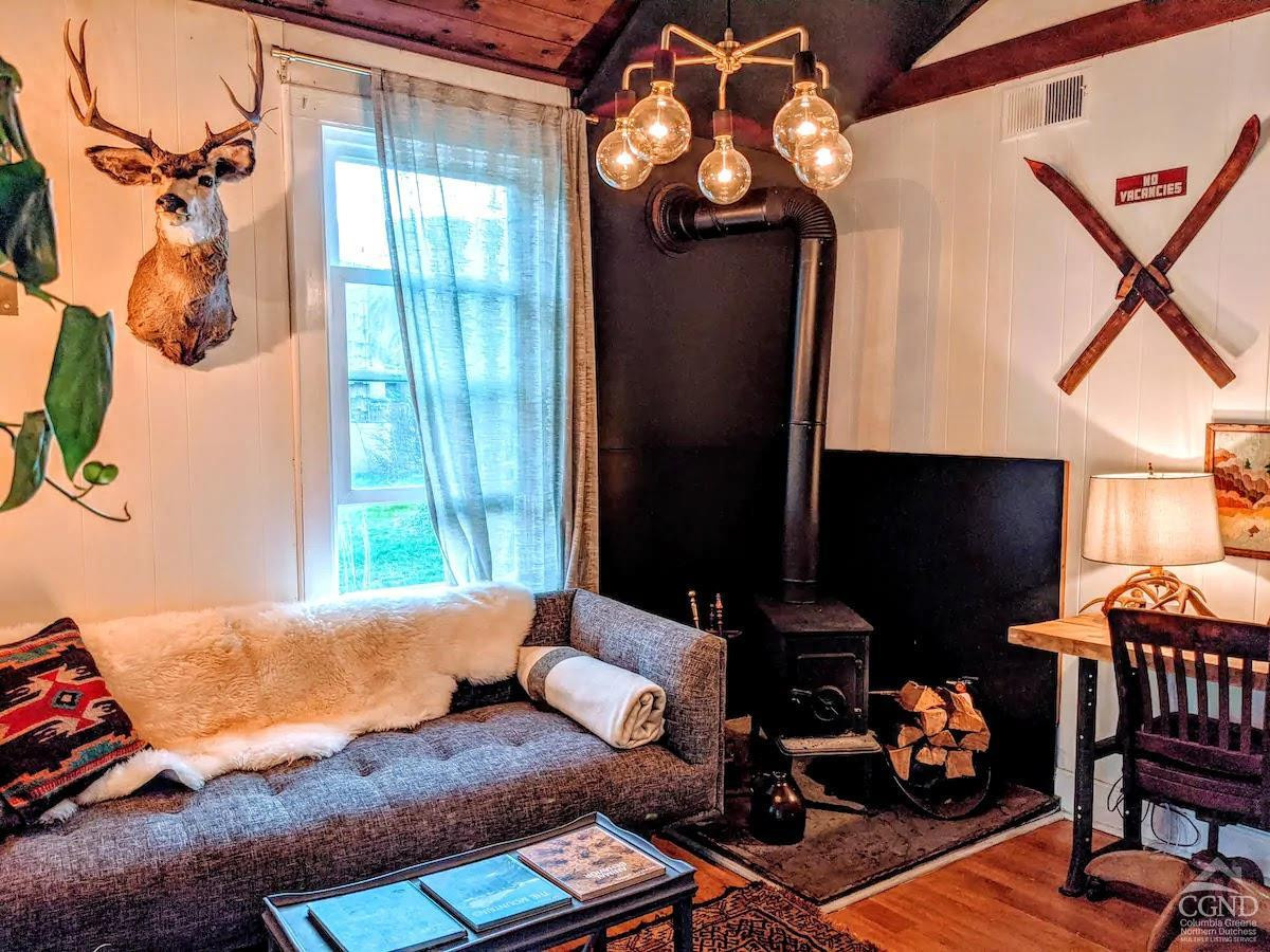 42-50 Stoney Clove Road Hunter, NY 12442 - Photo 27 of 82 a living room with furniture and a flat screen tv