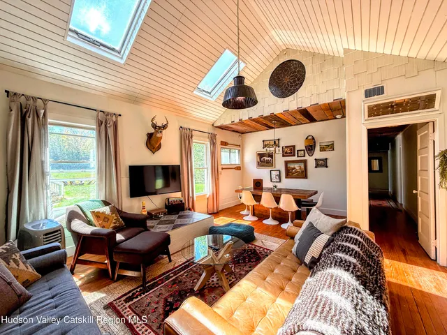 a bedroom with a bed and a chair