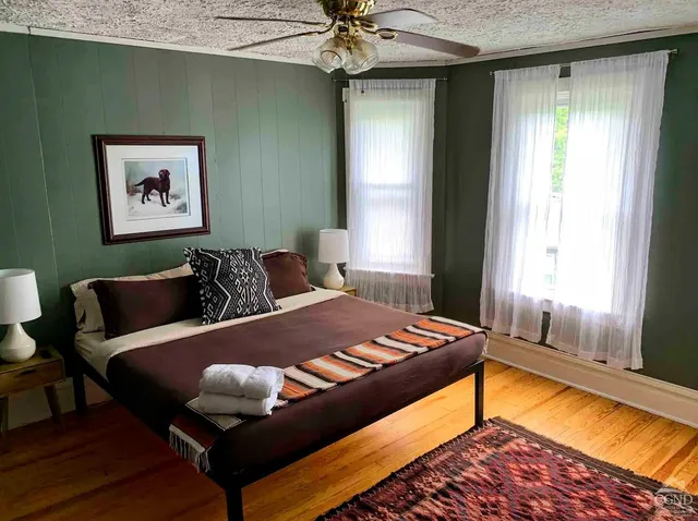 a bathroom with a sink a mirror and a shower
