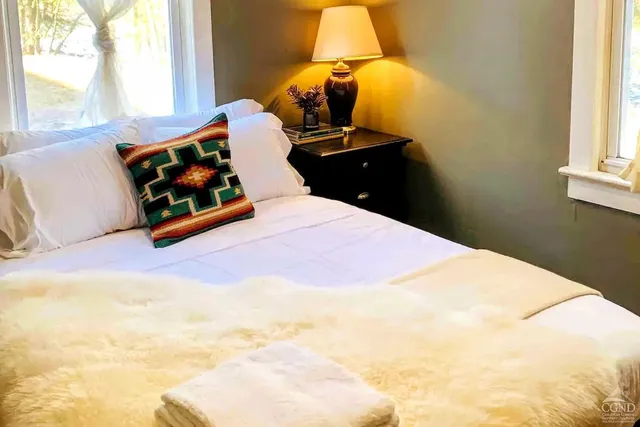 a view of table with a window and cabinet