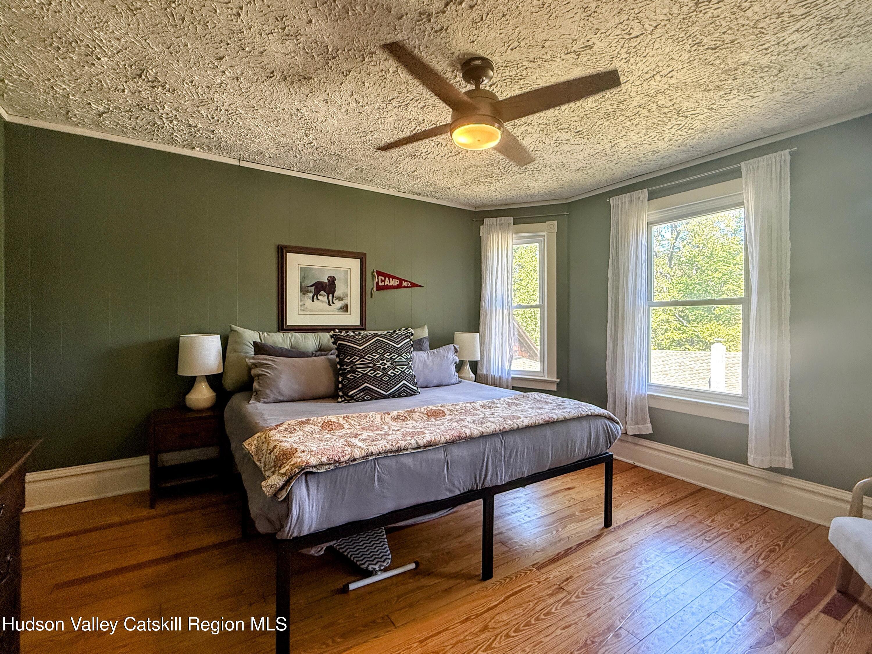 42-50 Stoney Clove Road Hunter, NY 12442 - Photo 37 of 82 a bedroom with a bed and a large window