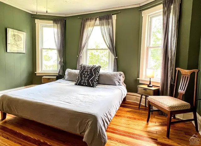 a backyard of a house with outdoor seating