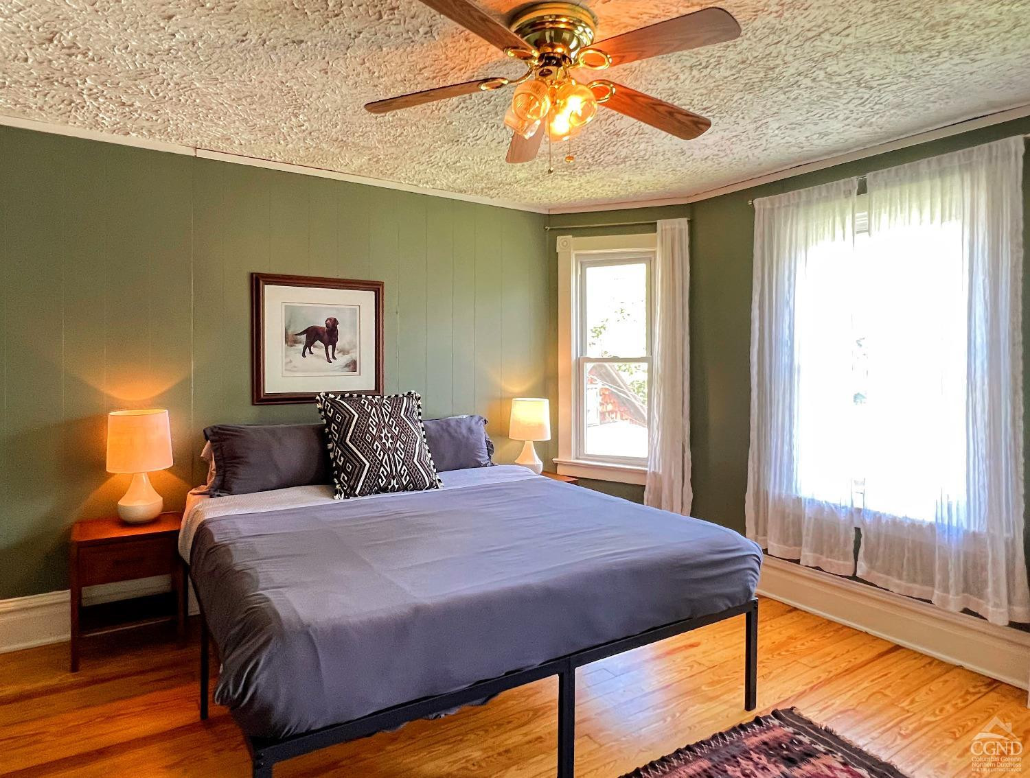 42-50 Stoney Clove Road Hunter, NY 12442 - Photo 43 of 82 a bedroom with a bed and a chandelier