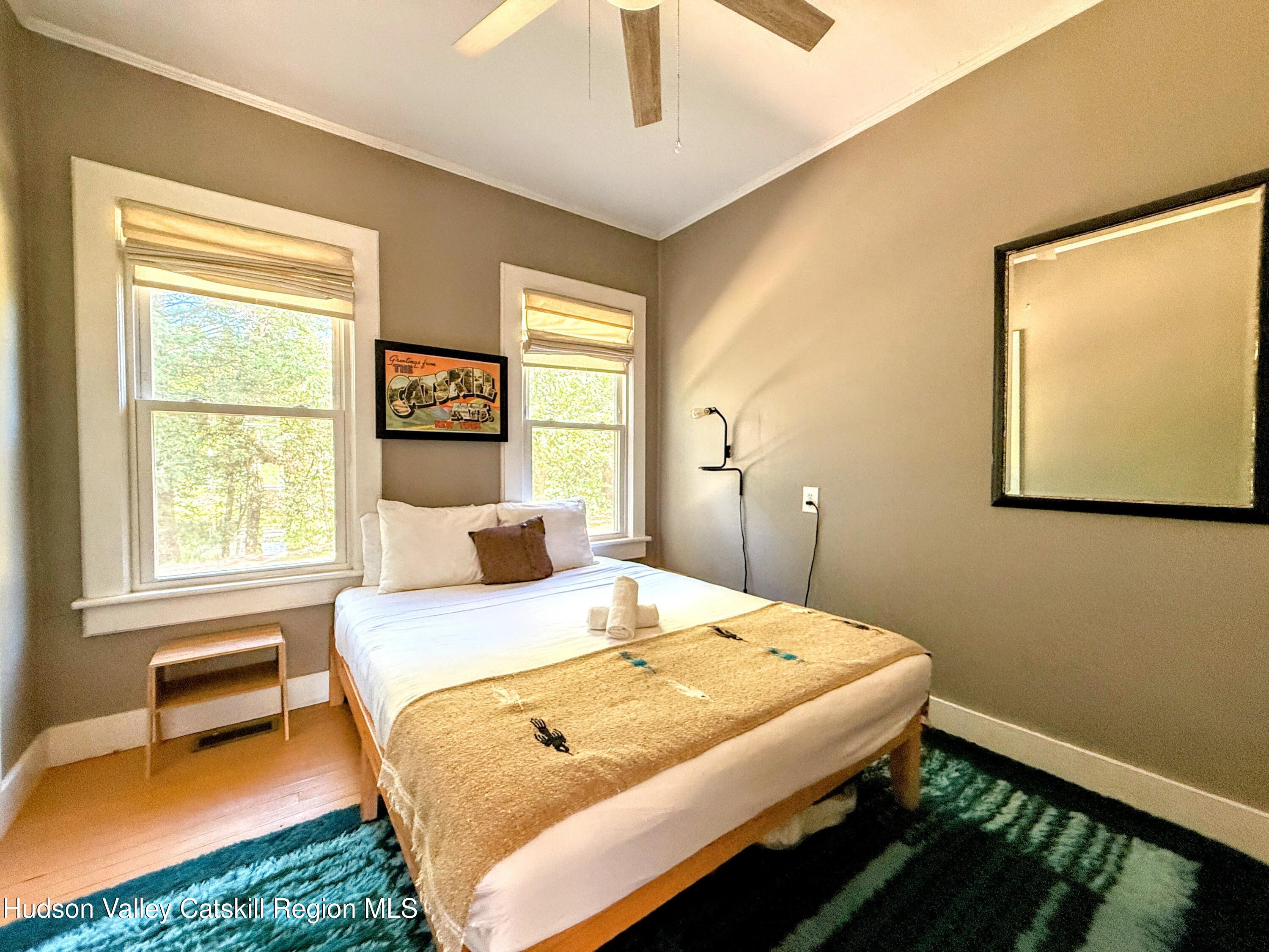 42-50 Stoney Clove Road Hunter, NY 12442 - Photo 46 of 82 a bedroom with a bed and a chair