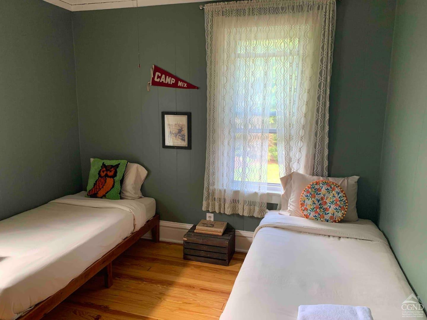 42-50 Stoney Clove Road Hunter, NY 12442 - Photo 52 of 82 a bedroom with a bed and a couch