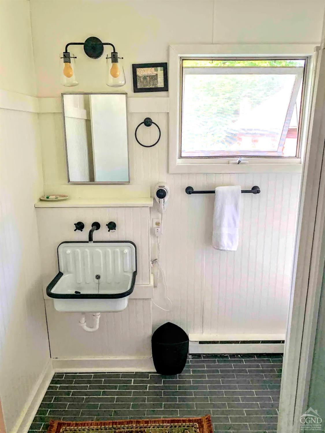 42-50 Stoney Clove Road Hunter, NY 12442 - Photo 55 of 82 a view of table with a window and cabinet