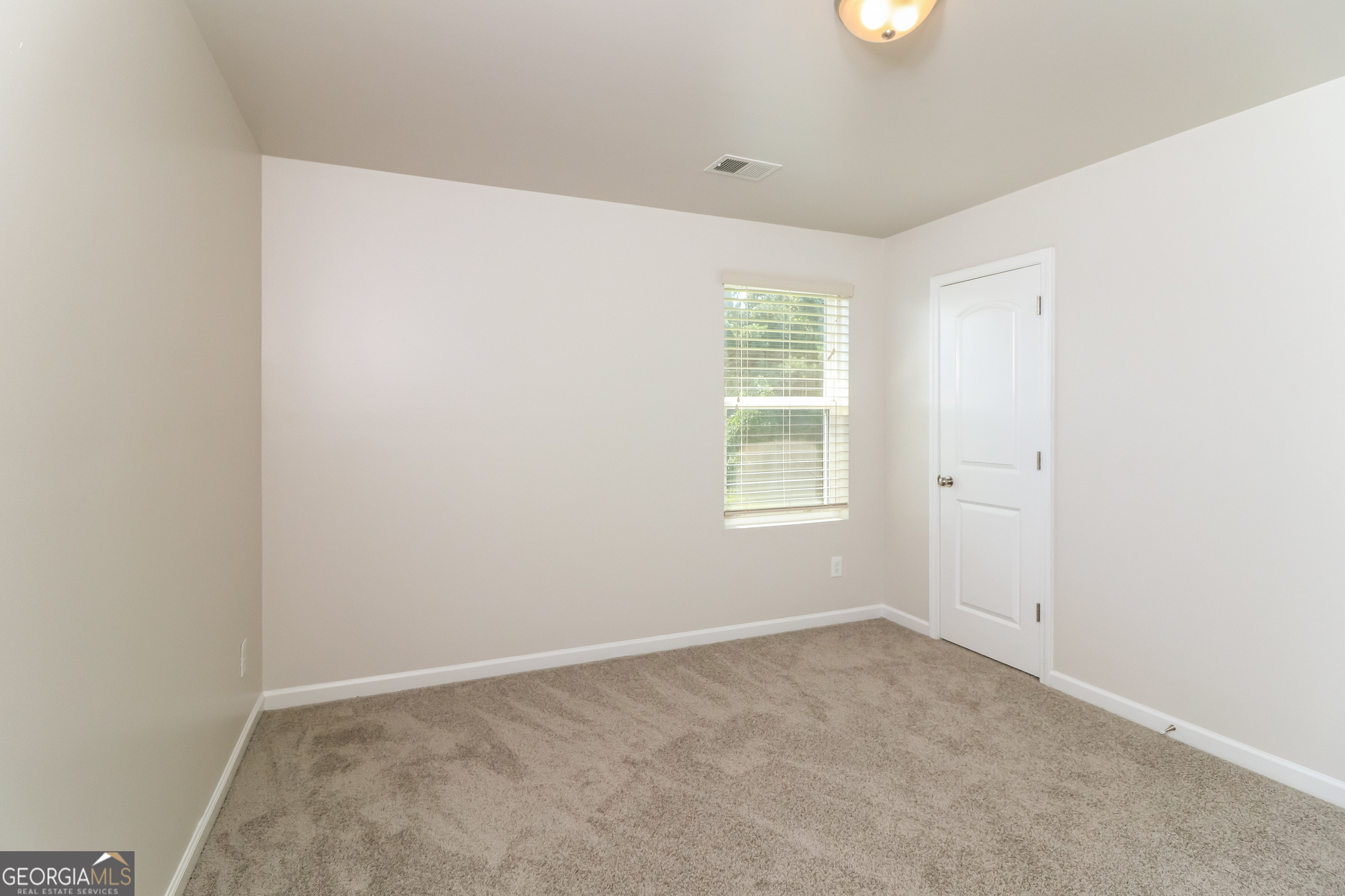 404 Scenic View Court Villa Rica, GA 30180 - Photo 13 of 17 an empty room with windows