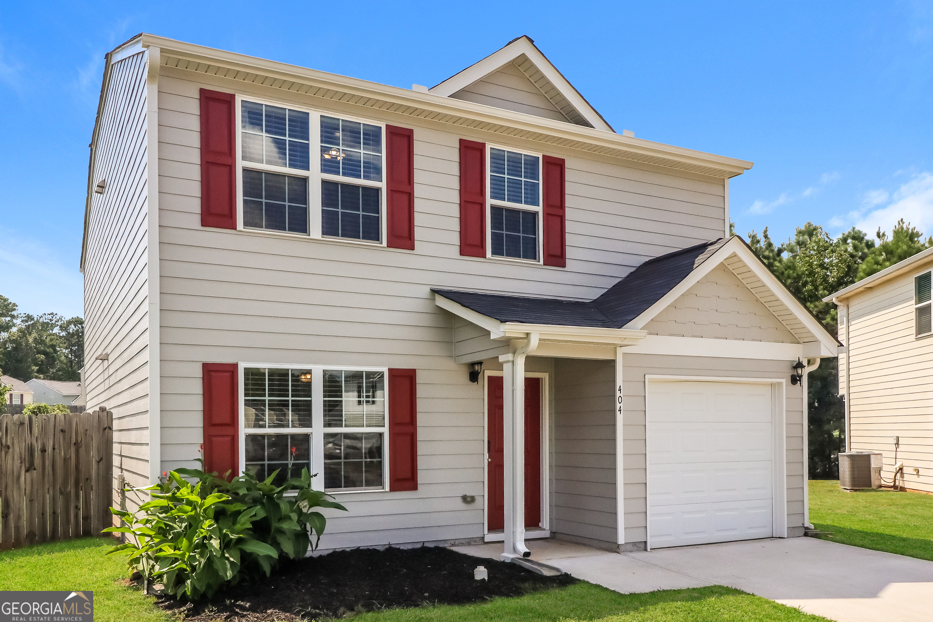 404 Scenic View Court Villa Rica, GA 30180 - Photo 2 of 17 a front view of a house with garden