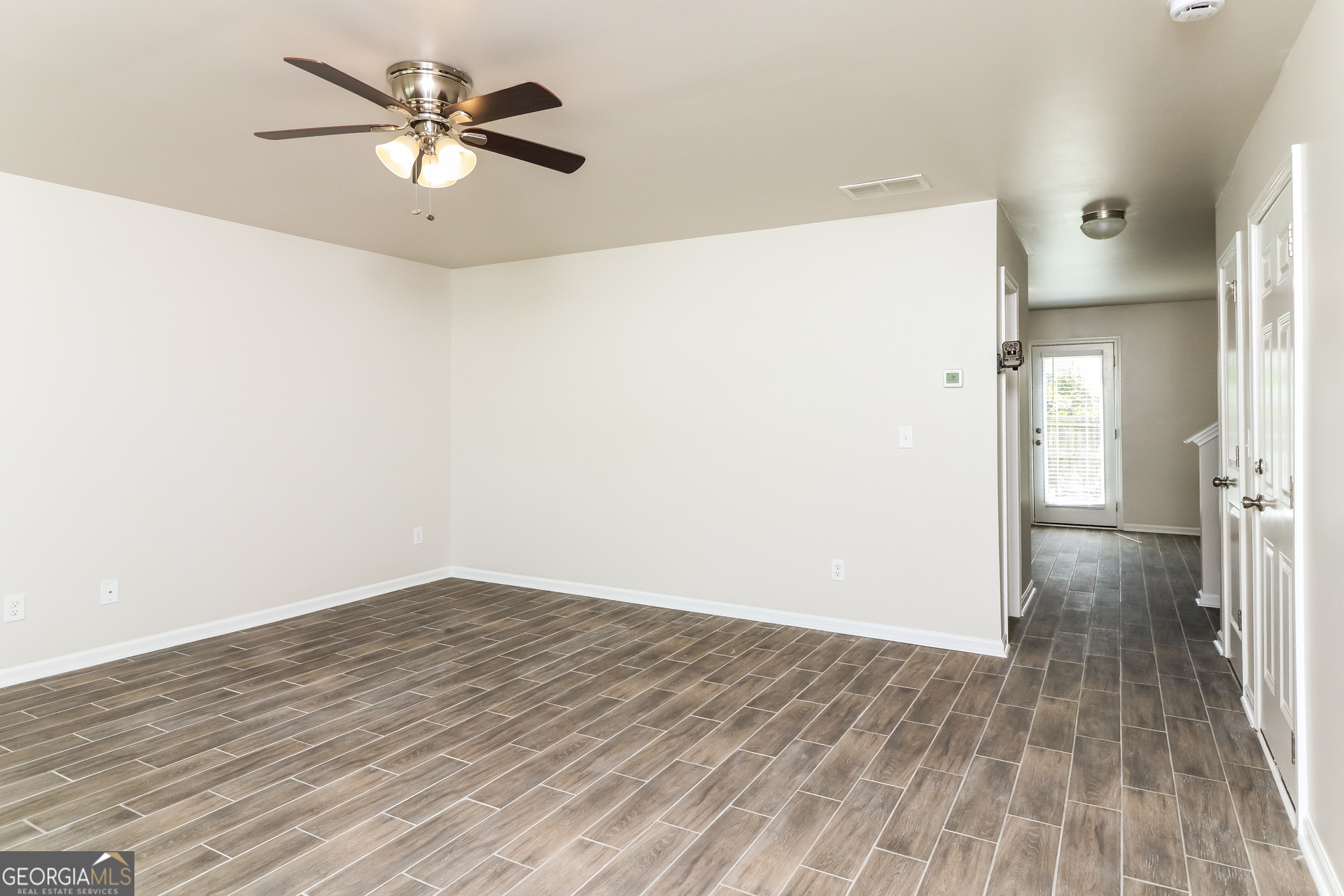 404 Scenic View Court Villa Rica, GA 30180 - Photo 4 of 17 wooden floor in an empty room