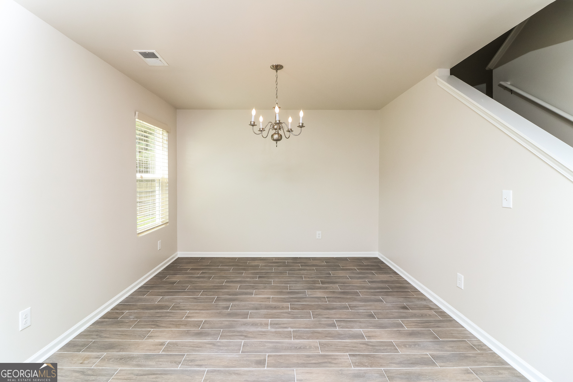 404 Scenic View Court Villa Rica, GA 30180 - Photo 6 of 17 a view of a room with wooden floor and chandelier