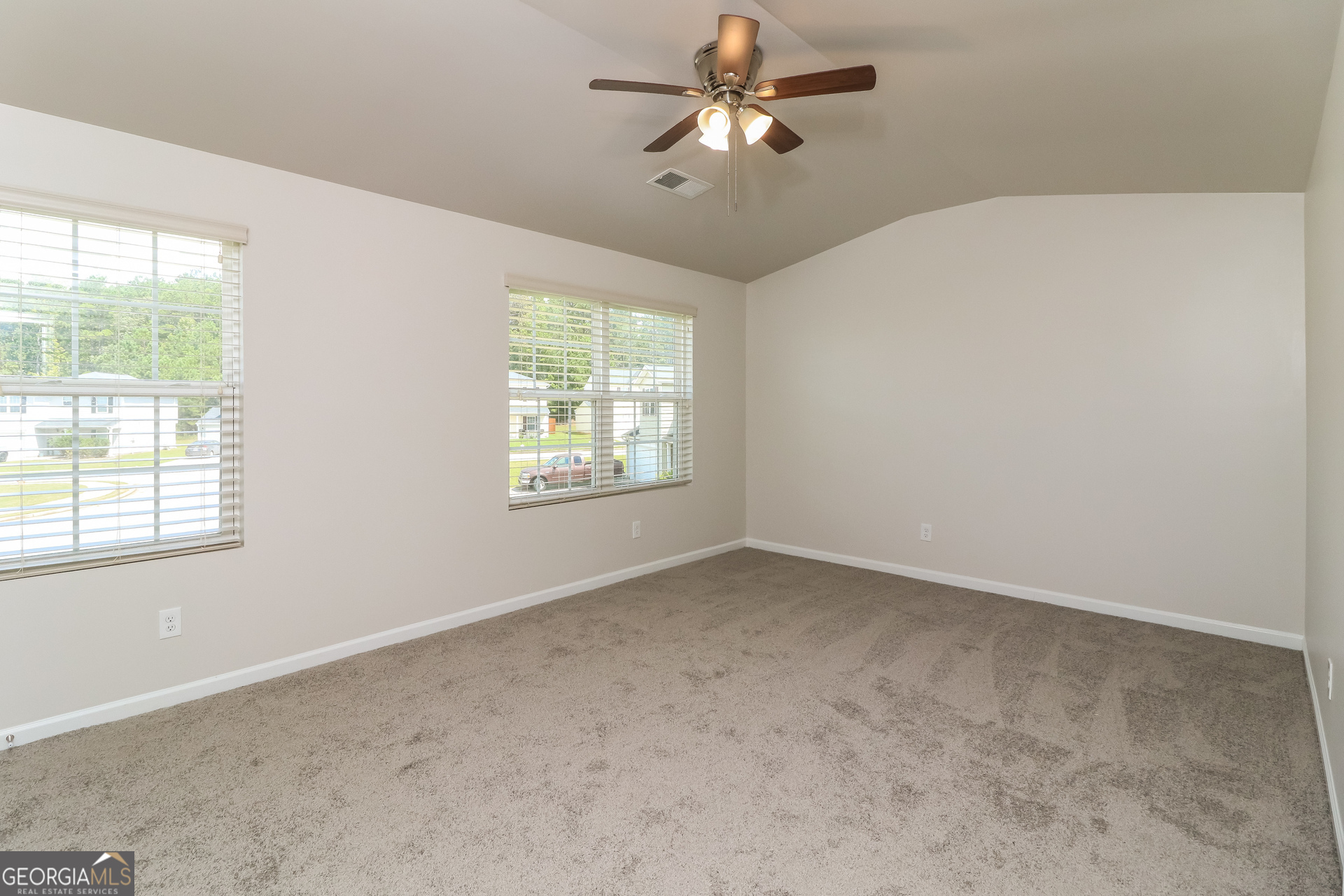 404 Scenic View Court Villa Rica, GA 30180 - Photo 10 of 17 an empty room with a window and a fan