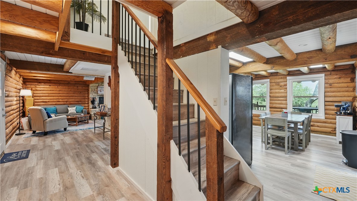 205 Bravo Road Canyon Lake, TX 78133 - Photo 15 of 38 a view of entryway livingroom and hall with wooden floor