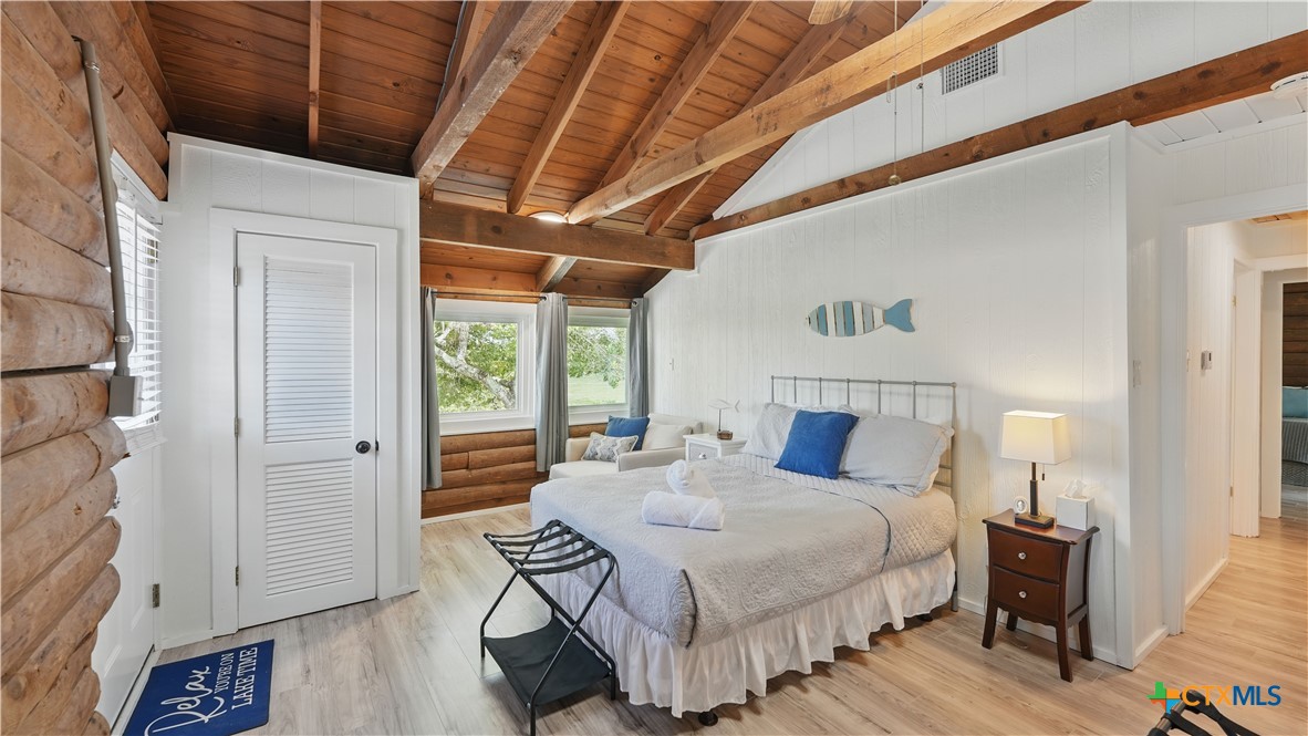 205 Bravo Road Canyon Lake, TX 78133 - Photo 17 of 38 a bedroom with a bed and a table