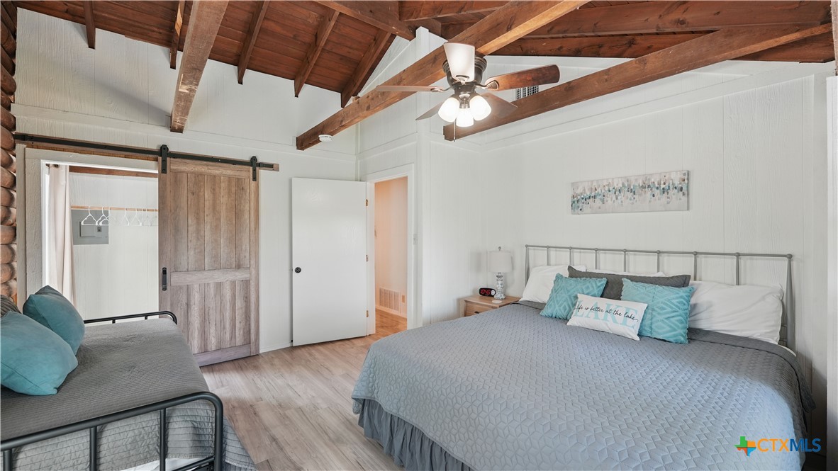 205 Bravo Road Canyon Lake, TX 78133 - Photo 22 of 38 a bed room with a bed and a couch