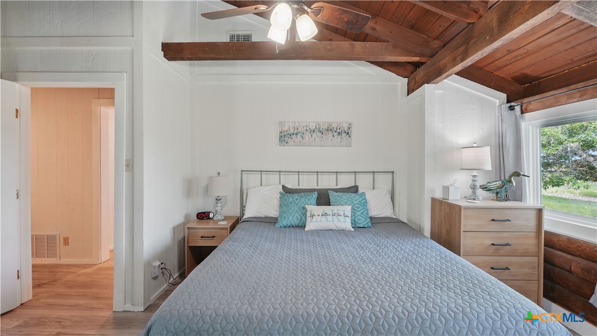 205 Bravo Road Canyon Lake, TX 78133 - Photo 23 of 38 a room with bed and window