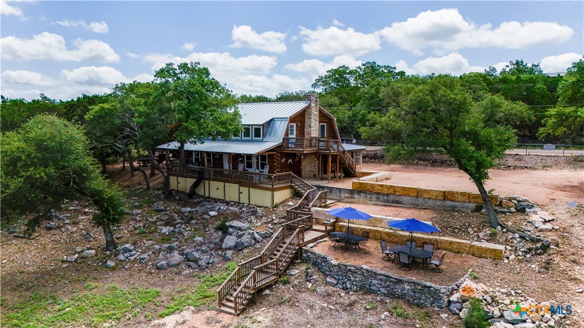 205 Bravo Road Canyon Lake, TX 78133 - Photo 32 of 38 a view of swings on a table and chairs