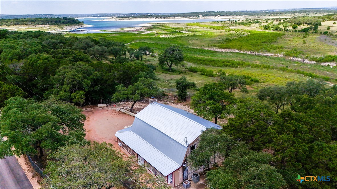 205 Bravo Road Canyon Lake, TX 78133 - Photo 33 of 38 an aerial view of residential houses with outdoor space and swimming pool