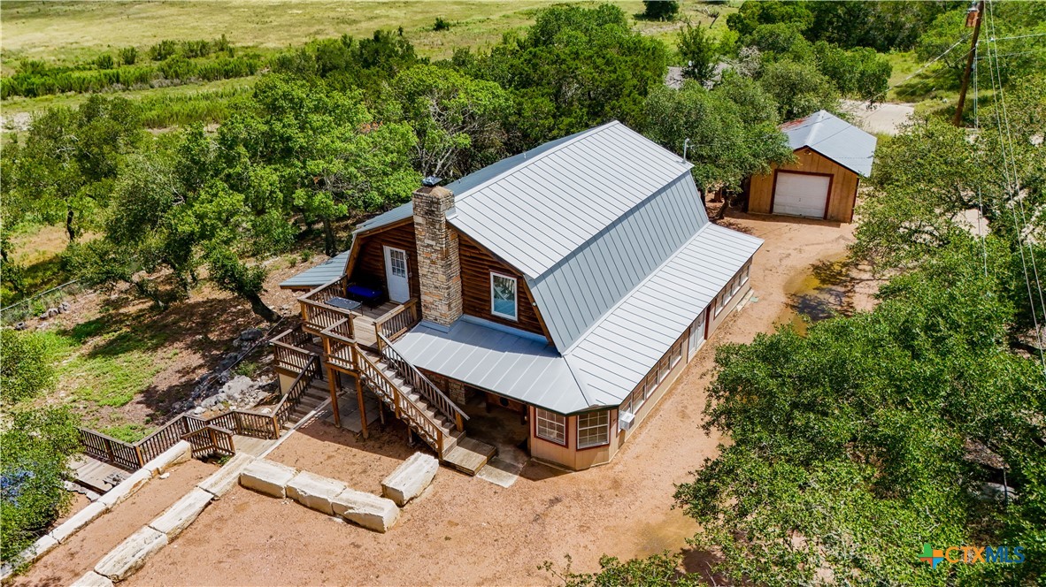 205 Bravo Road Canyon Lake, TX 78133 - Photo 35 of 38 an aerial view of a house with a yard