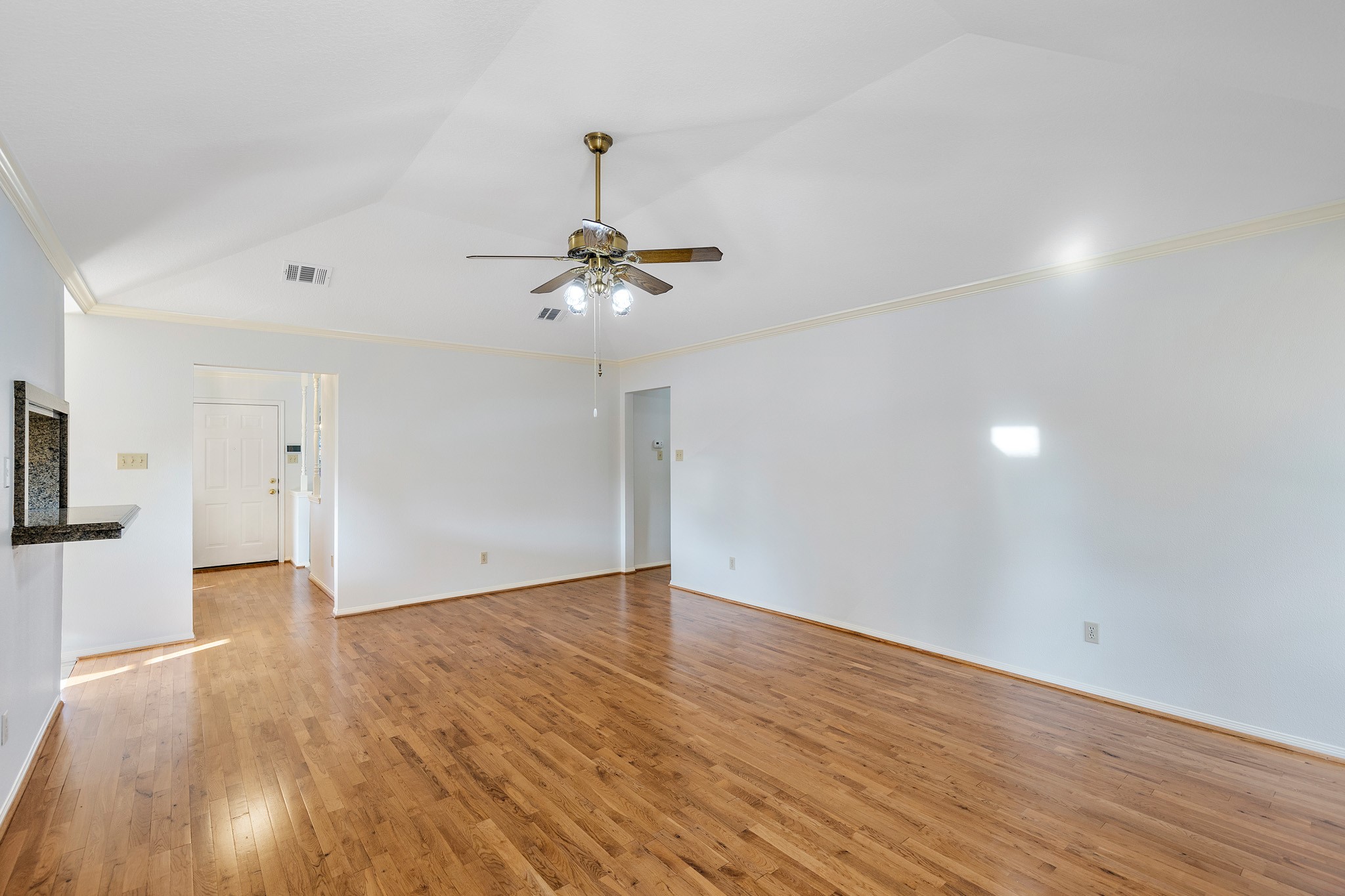 8018 Holiday Lane Houston, TX 77075 - Photo 14 of 42 a view of empty room with wooden floor