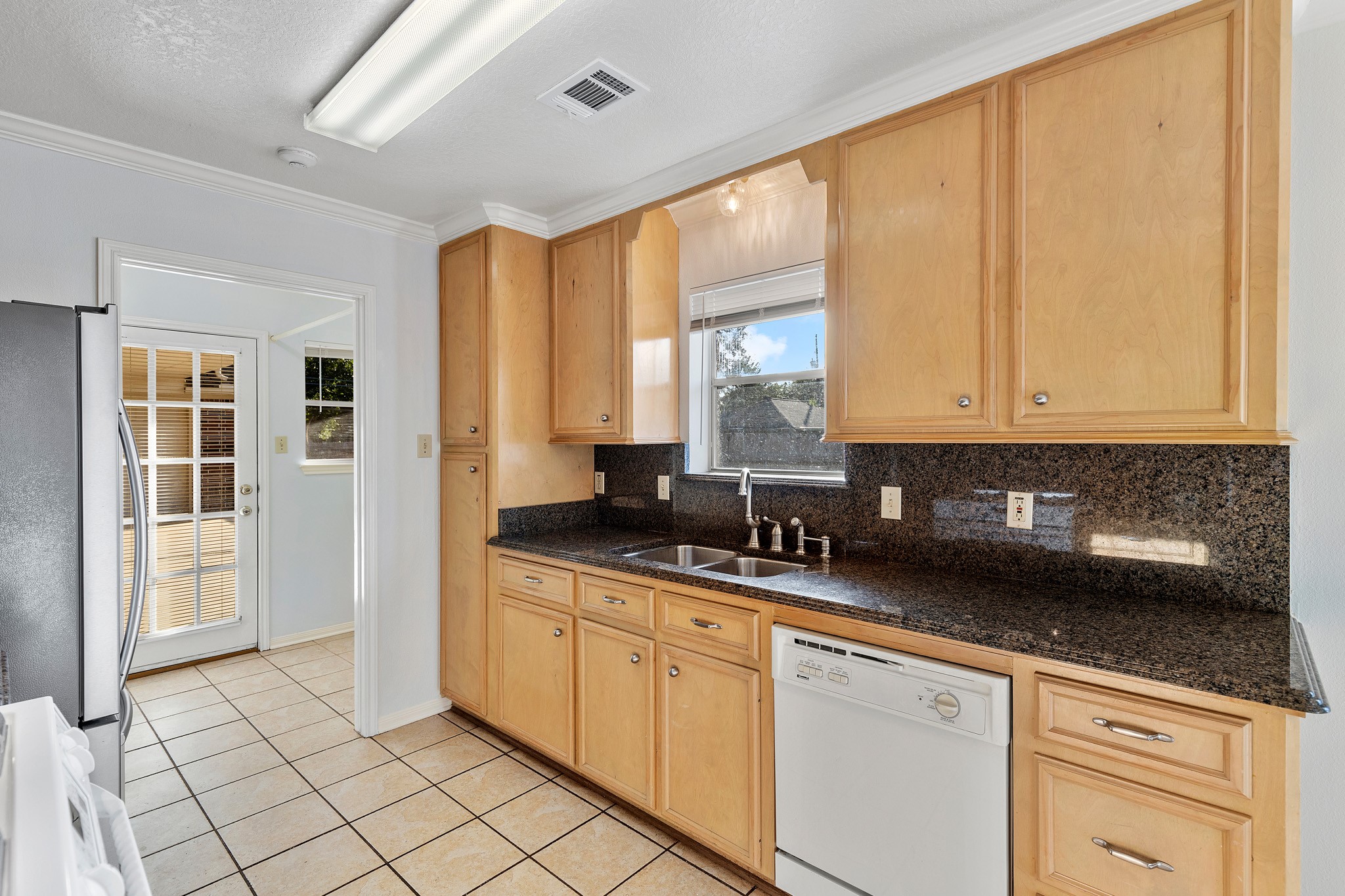 8018 Holiday Lane Houston, TX 77075 - Photo 19 of 42 a kitchen with stainless steel appliances granite countertop a sink and a cabinets