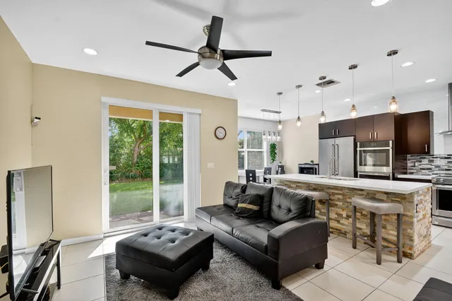 a living room with furniture and a large window