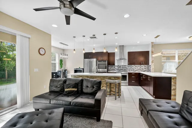 a living room with fireplace furniture and a flat screen tv