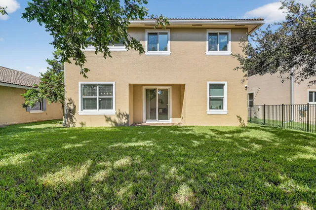 a view of a big room with yard and front door